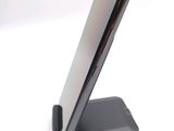 a cell phone that is sitting on top of a stand