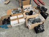 several boxes of assorted items sitting on the floor in a warehouse