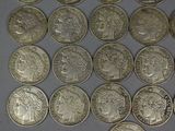 a lot of coins that are on the table