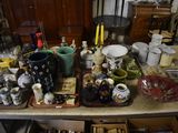 a table with many different types of vases on it