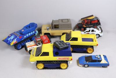 a lot of toy cars that are sitting on a table