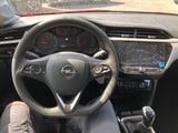 the interior of a car with a steering wheel and dashboard controls