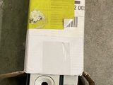 a black and white cell phone that is in a box