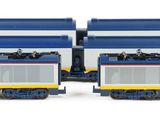 two blue and white trains on the tracks next to each other