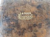 an old book with a gold logo on it