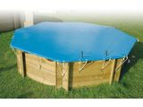 a wooden pool with a blue cover on top of it