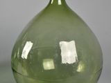 two green vases sitting next to each other on a table