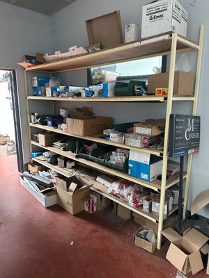 many boxes and boxes on the shelves in the room