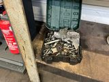 a box of tools sitting on a shelf in a garage