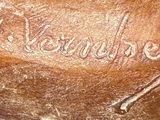 a close up of a baseball glove with a name engraved on it