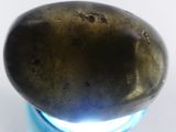 an image of a metal object with a light in it