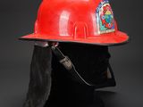 a red hard hat on a black mannequin head