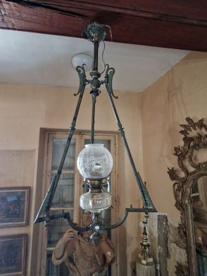 a chandelier hanging from the ceiling in a room