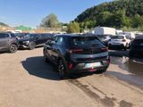 many cars parked in a parking lot in a lot