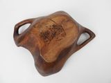a close up of a wooden tray with handles on a white surface
