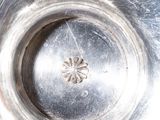 a close up of a metal object with a hole in it