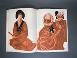 an open book with a picture of two men in robes