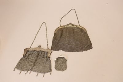 two purses that are sitting on a table