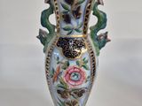 a vase that is sitting on a white table