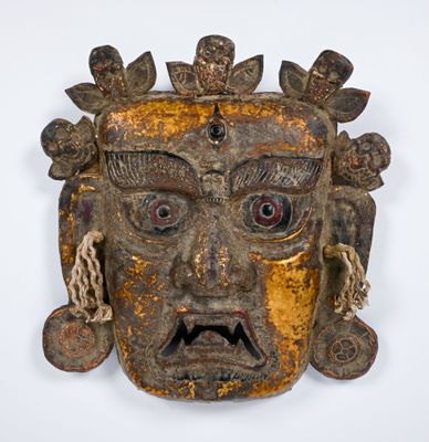 an image of a wooden mask on a white background