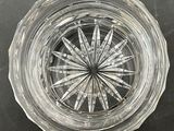 a clear glass bowl with a starburst in it