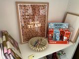 a picture of a shelf with toys and a picture on it