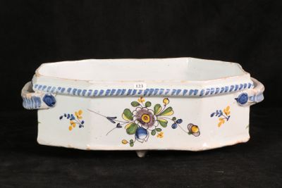 a white bowl with blue and yellow flowers on it