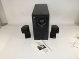 a black speaker system on a white table