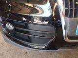 a close up of a black car with a license plate on it