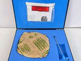 a blue case with a piece of paper inside of it