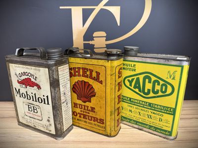 three tins that are sitting on a table