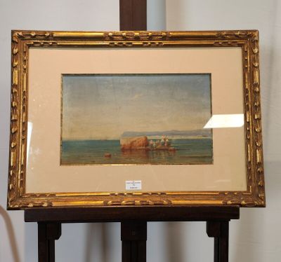 une image d'un tableau sur un chevalet dans une pièce