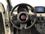 the interior of a small car with a steering wheel and dashboard
