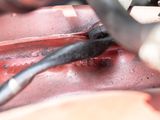 a close up of a motorcycle engine with wires attached to it