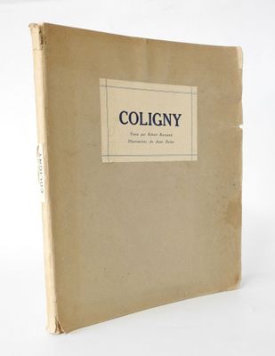 an old book sitting on top of a white table