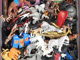 a box full of toy animals that are in the box