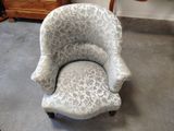 a chair that is sitting in the middle of a room