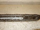 an old chainsaw on the floor in a room