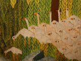 a lot of birds that are standing in the grass