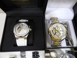 two watches that are in a box on the table