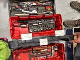 a man that is working on some tools in a garage