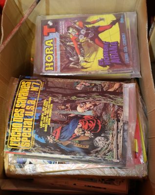 two comics in a box on the table