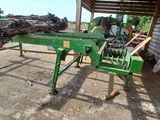 a picture of a log spliter being used to cut logs