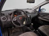 dashboard of a small car with a steering wheel and dashboard controls