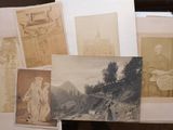 many old photos of people and buildings on this table