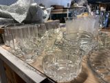 a lot of glasses on the table ready to be used