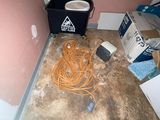 a picture of a room with a lot of stuff on the floor