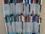 a lot of pens that are lined up on the wall