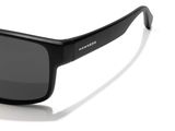 a close up of a pair of sunglasses on a white surface