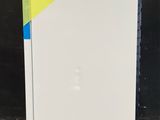 a white refrigerator with a yellow and blue sticker on it
